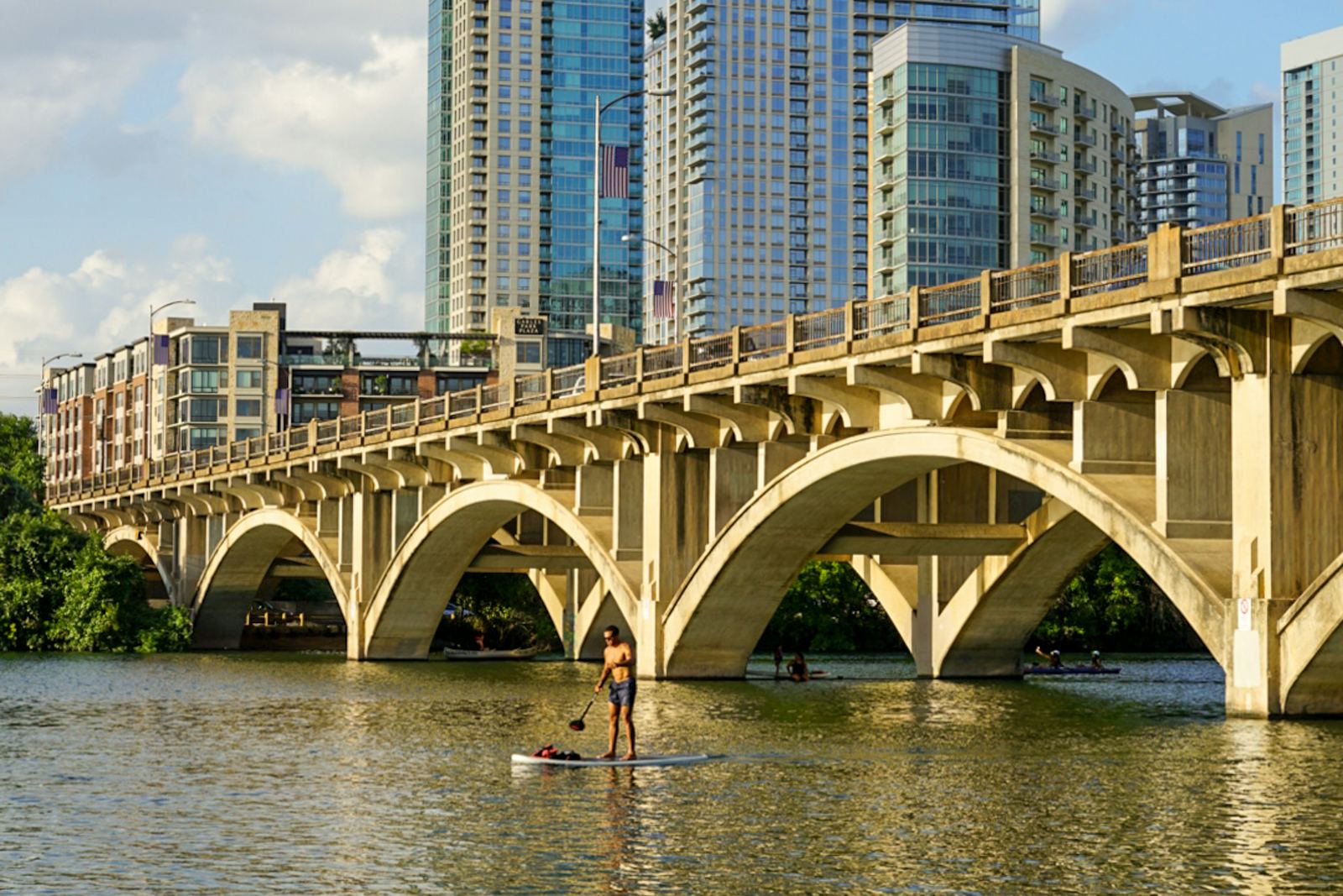 Paddleboarding on Lady Bird Lake below the Austin skyline, Texas