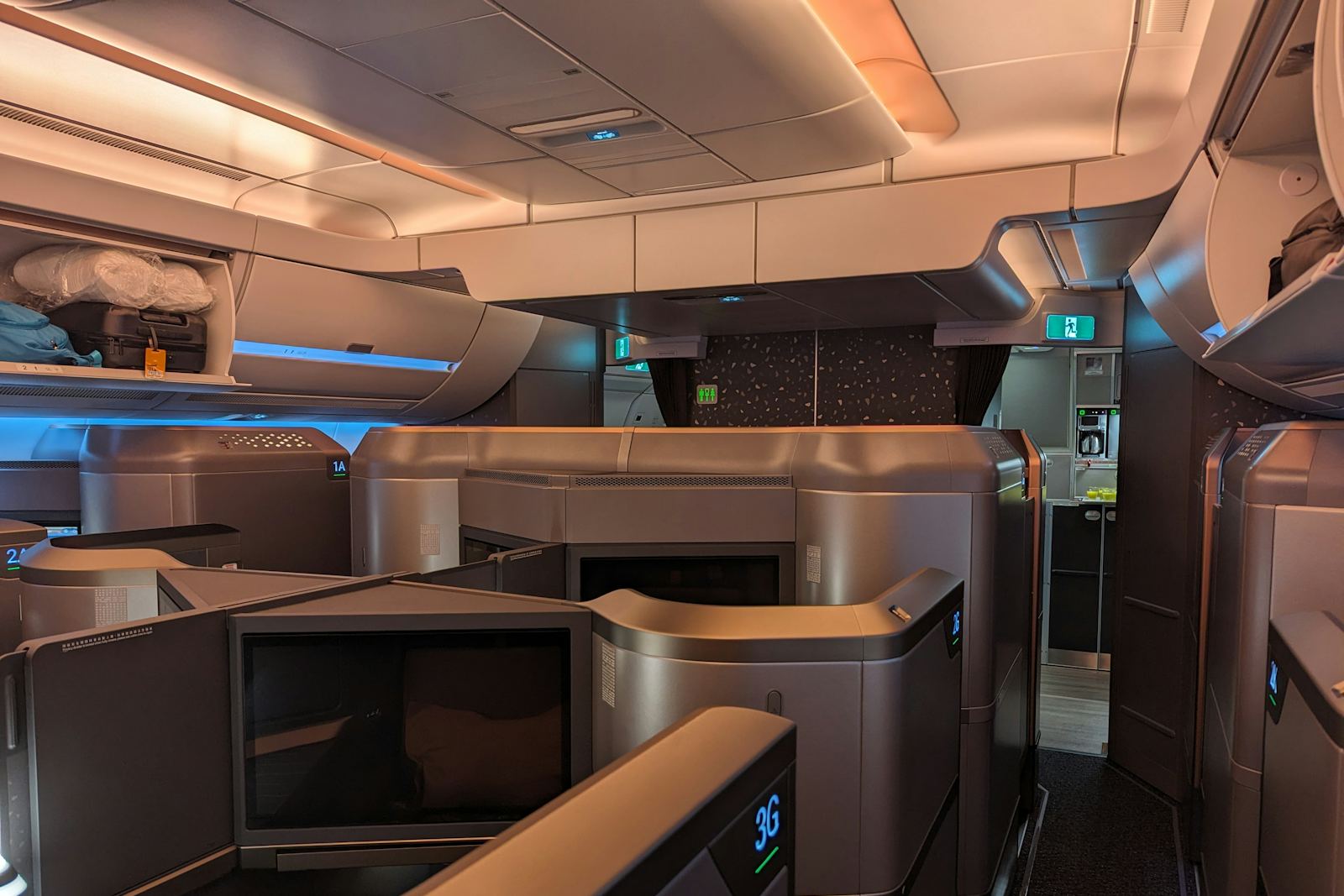 Private first-class suites in a modern aircraft cabin