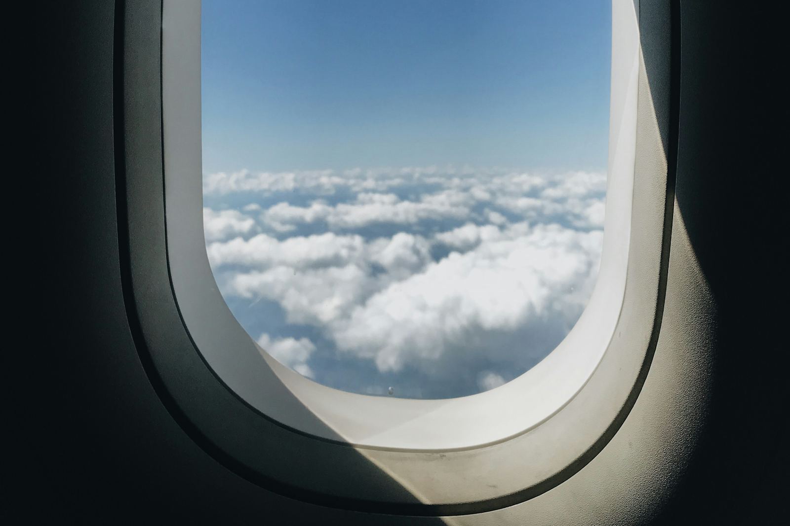 View of clouds through an airplane window